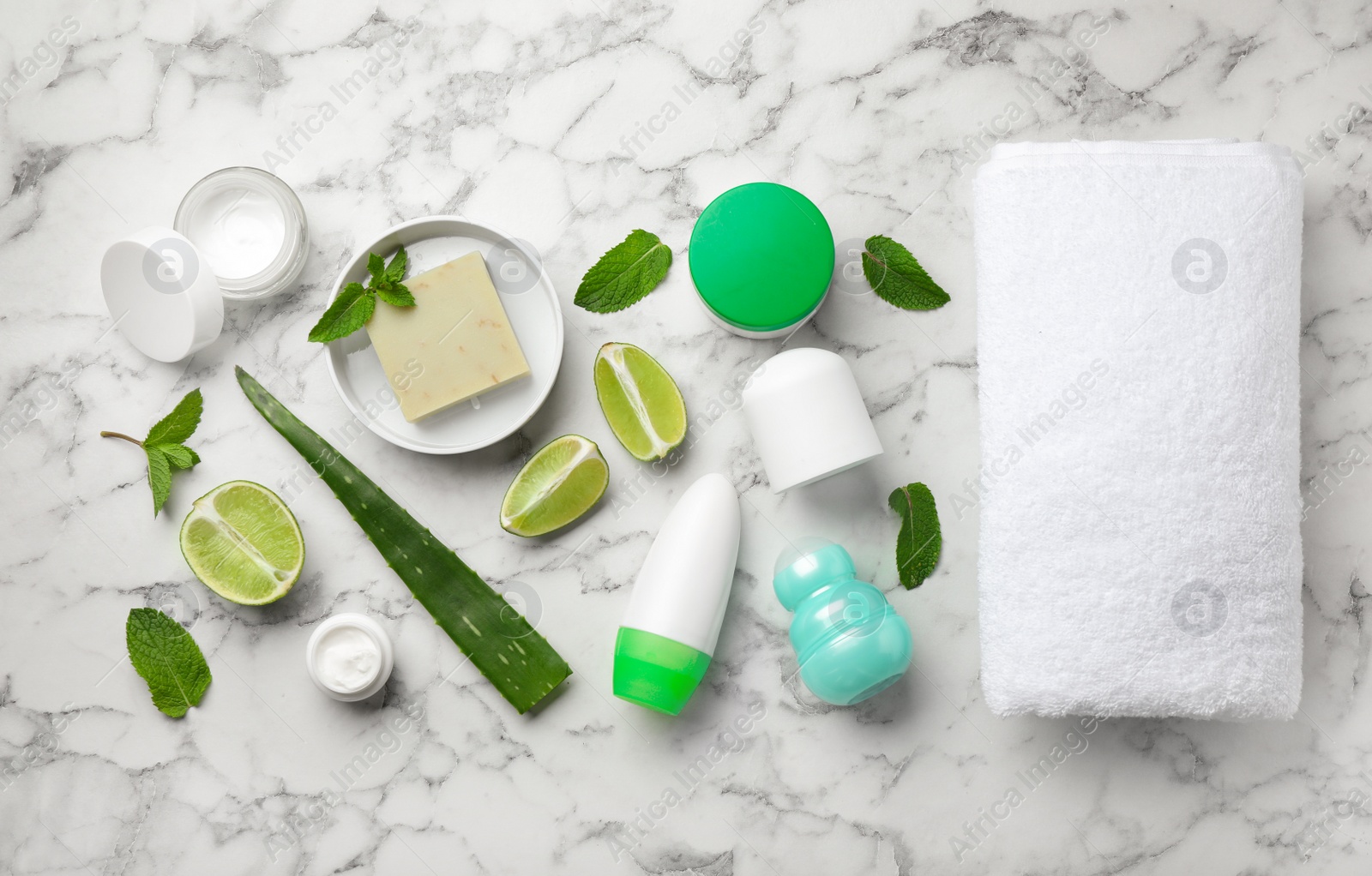 Photo of Flat lay composition with natural deodorants on white marble table