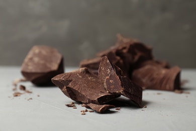 Photo of Delicious dark chocolate on table, closeup