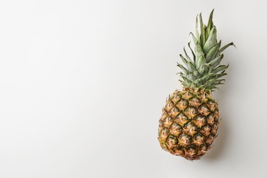 Photo of Fresh pineapple on light background