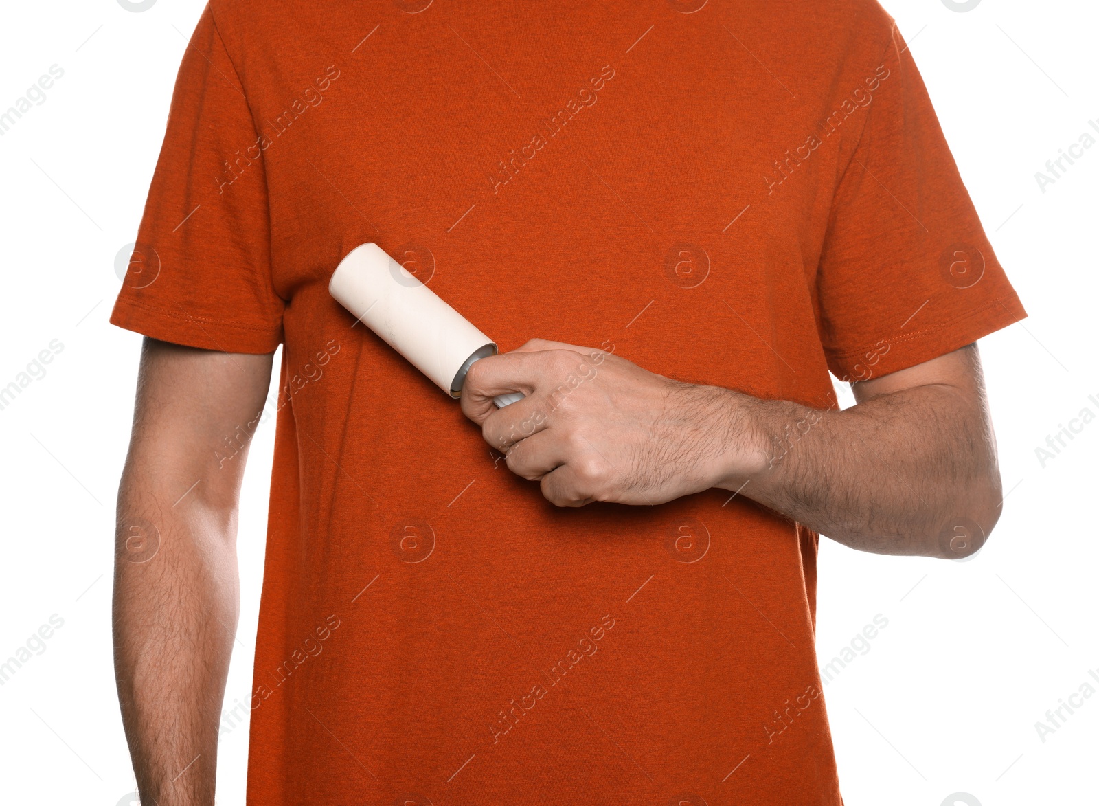 Photo of Man using lint roller on white background, closeup