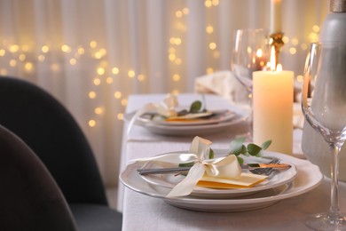 Photo of Festive table setting with beautiful decor indoors, closeup