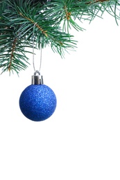 Photo of Blue Christmas ball hanging on fir tree branch against white background