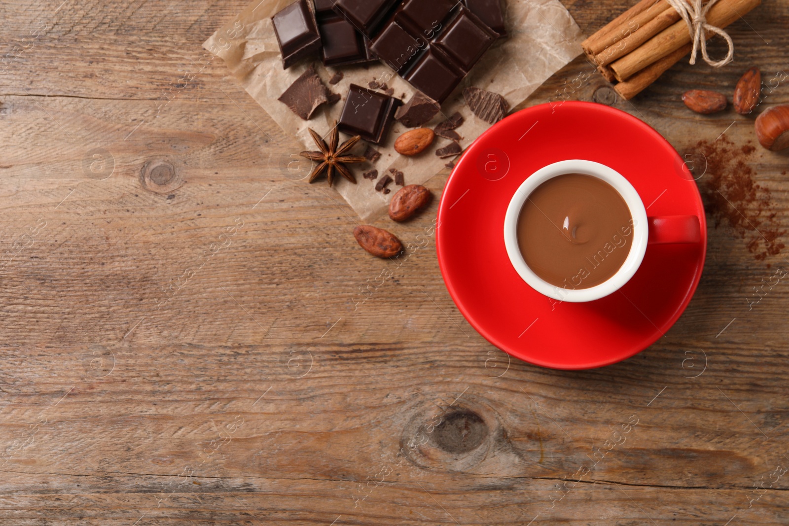 Photo of Flat lay composition with yummy hot chocolate on wooden table. Space for text