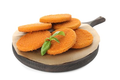 Photo of Delicious fried breaded cutlets with basil leaves isolated on white