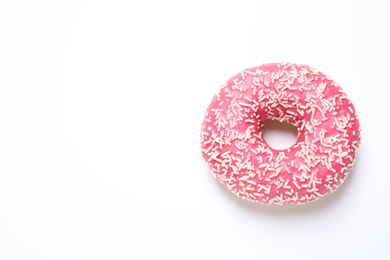 Photo of Delicious glazed donut on white background, top view. Space for text