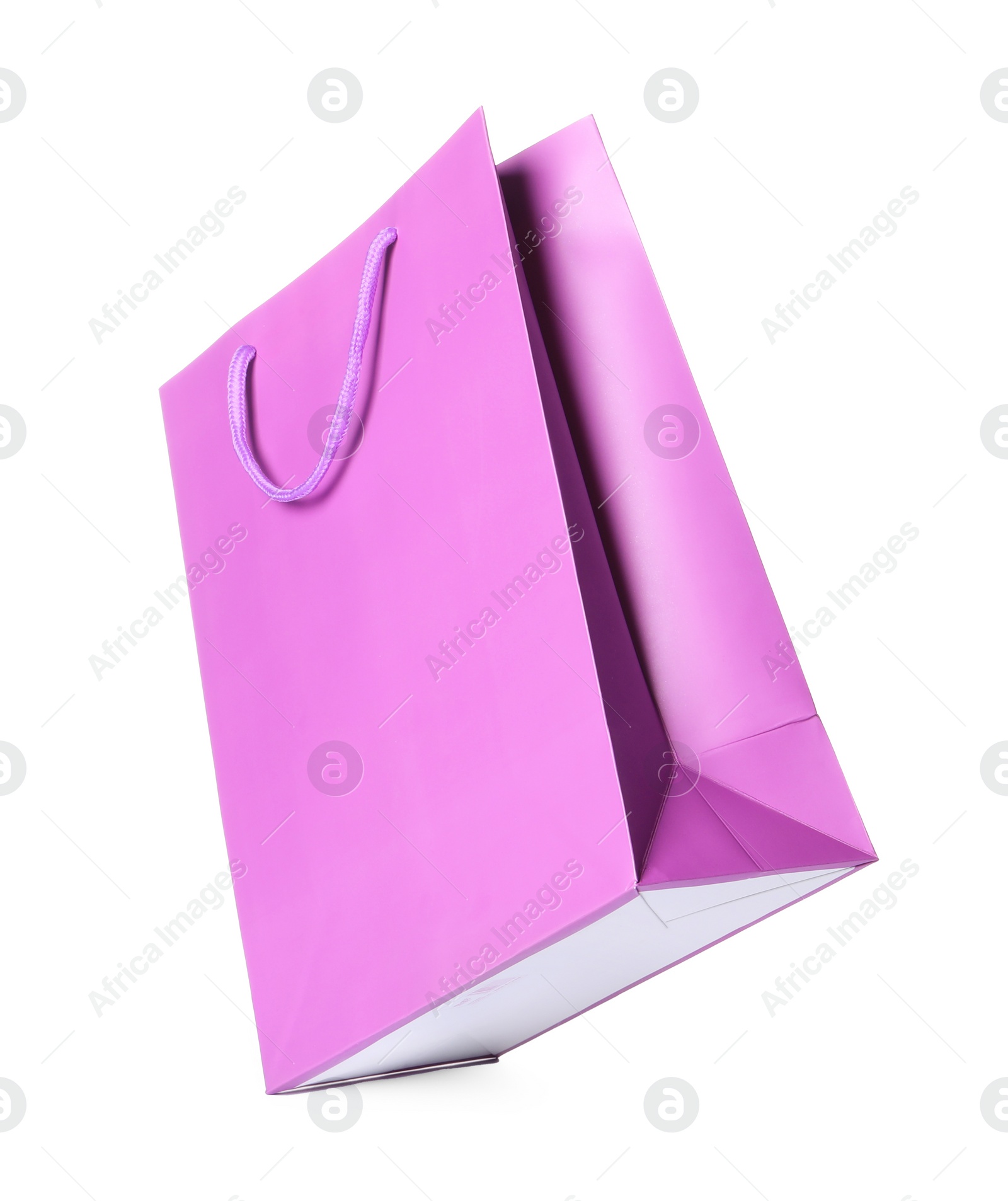 Photo of One violet shopping bag isolated on white