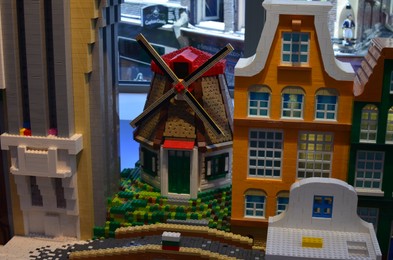 Photo of AMSTERDAM, NETHERLANDS - JULY 16, 2022: Buildings made with colorful Lego constructor indoors