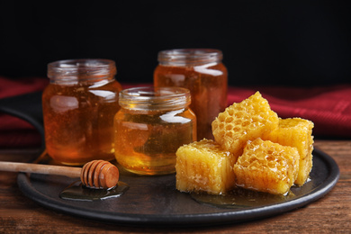 Photo of Composition with fresh delicious honey on wooden table