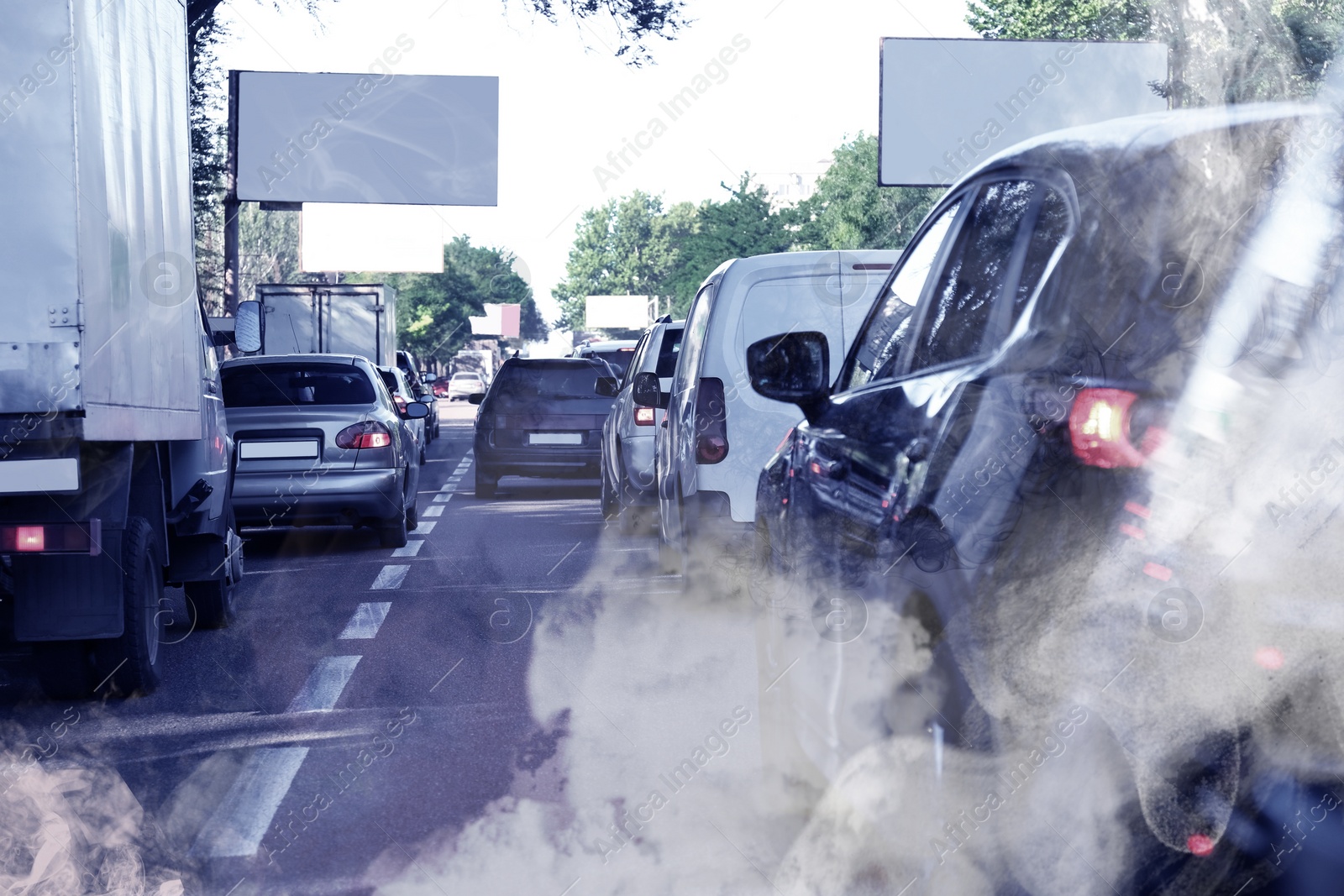 Image of Environmental pollution. Air contaminated with fumes in city. Cars surrounded by exhaust on road