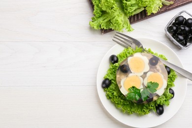 Photo of Delicious aspic with meat and vegetables served on white wooden table, flat lay. Space for text