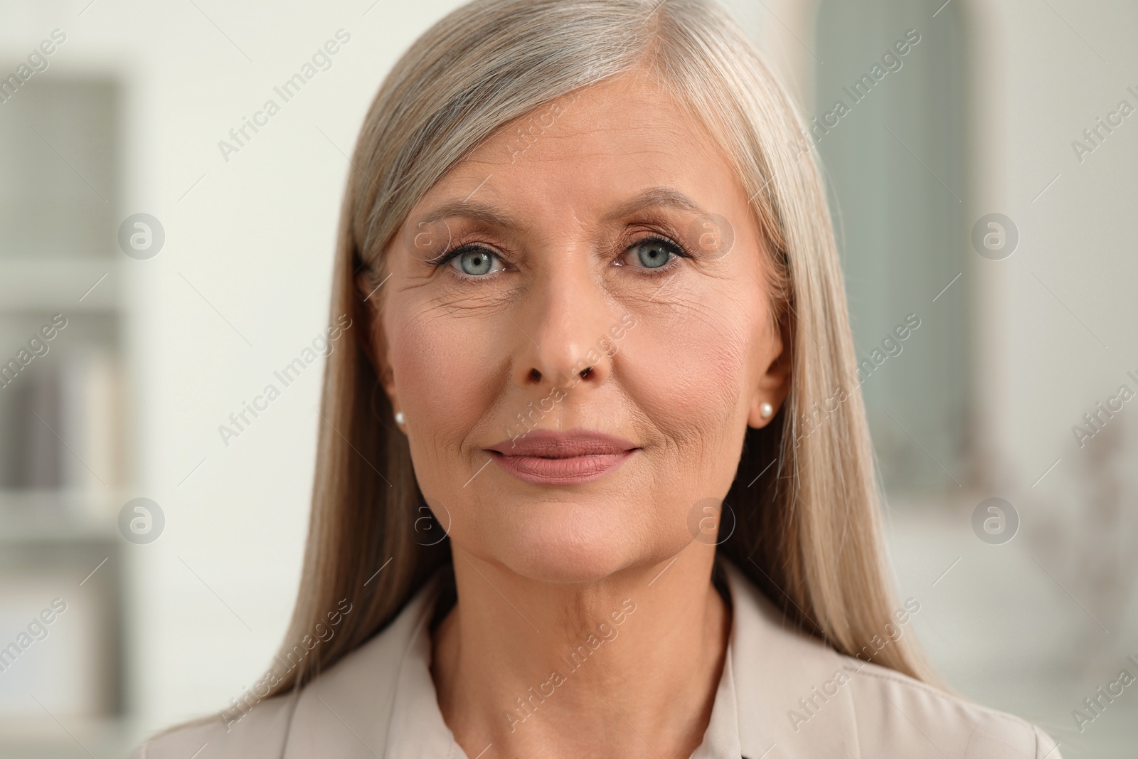 Photo of Portrait of beautiful senior woman at home