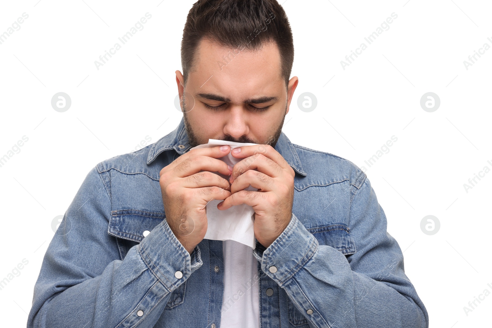 Photo of Sick man with tissue coughing on white background