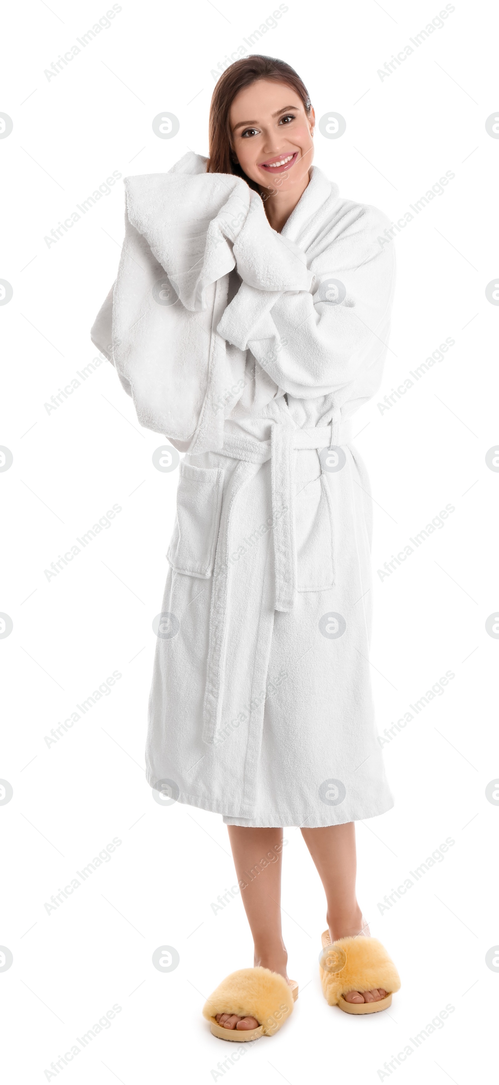 Photo of Young woman in bathrobe drying hair with towel on white background