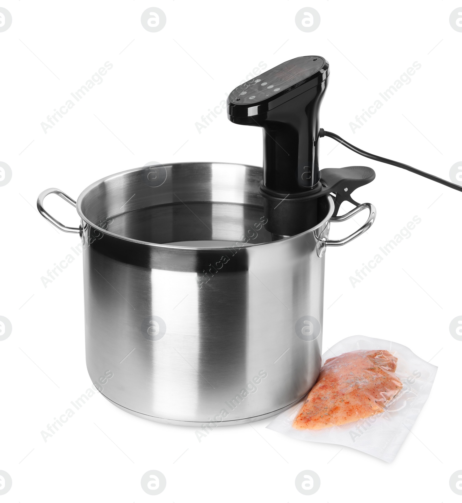 Photo of Thermal immersion circulator in pot and meat on white background. Vacuum packing for sous vide cooking