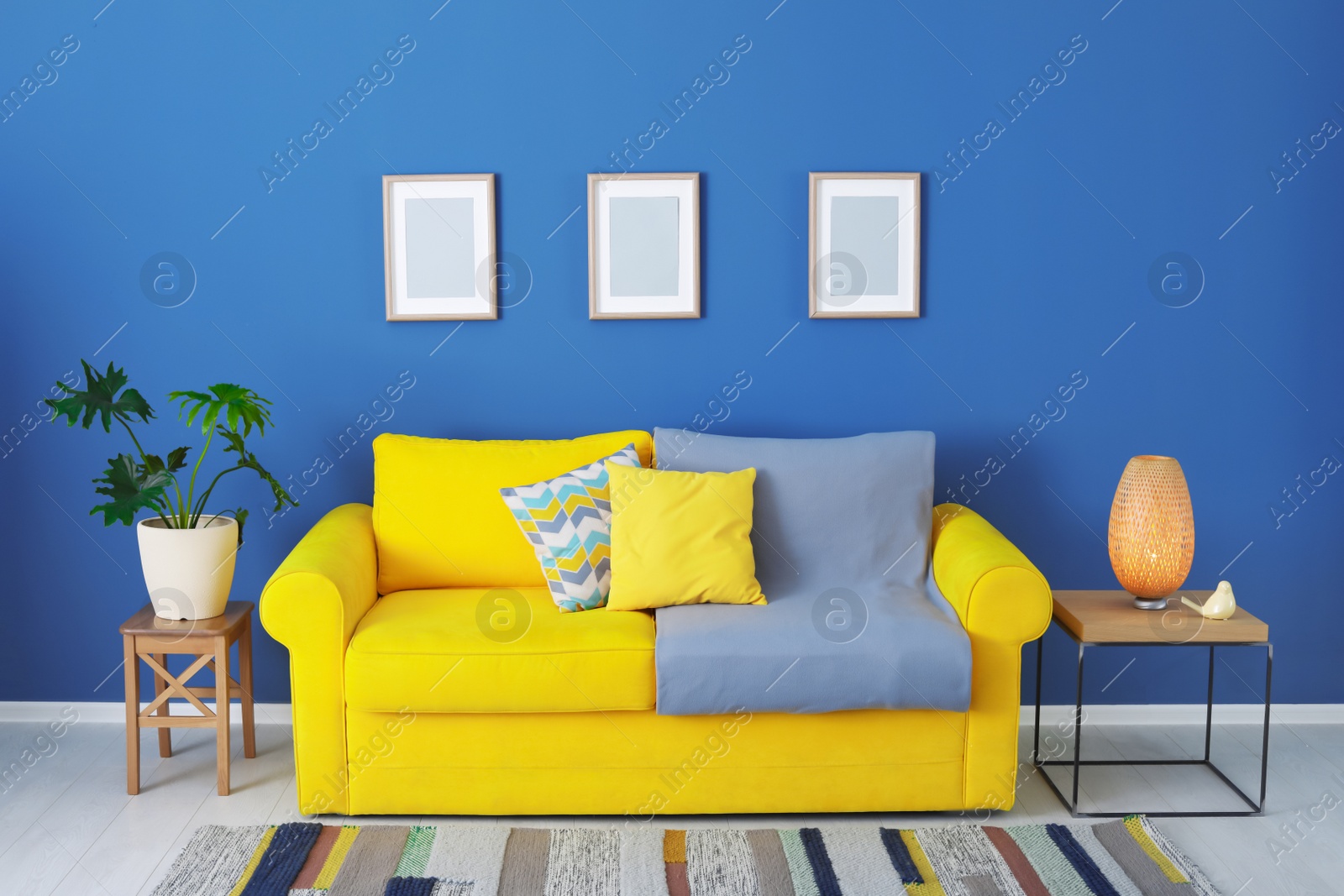 Photo of Stylish living room interior with comfortable sofa