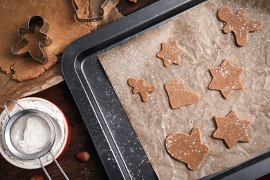 Photo of Flat lay composition with raw Christmas cookies on wooden table