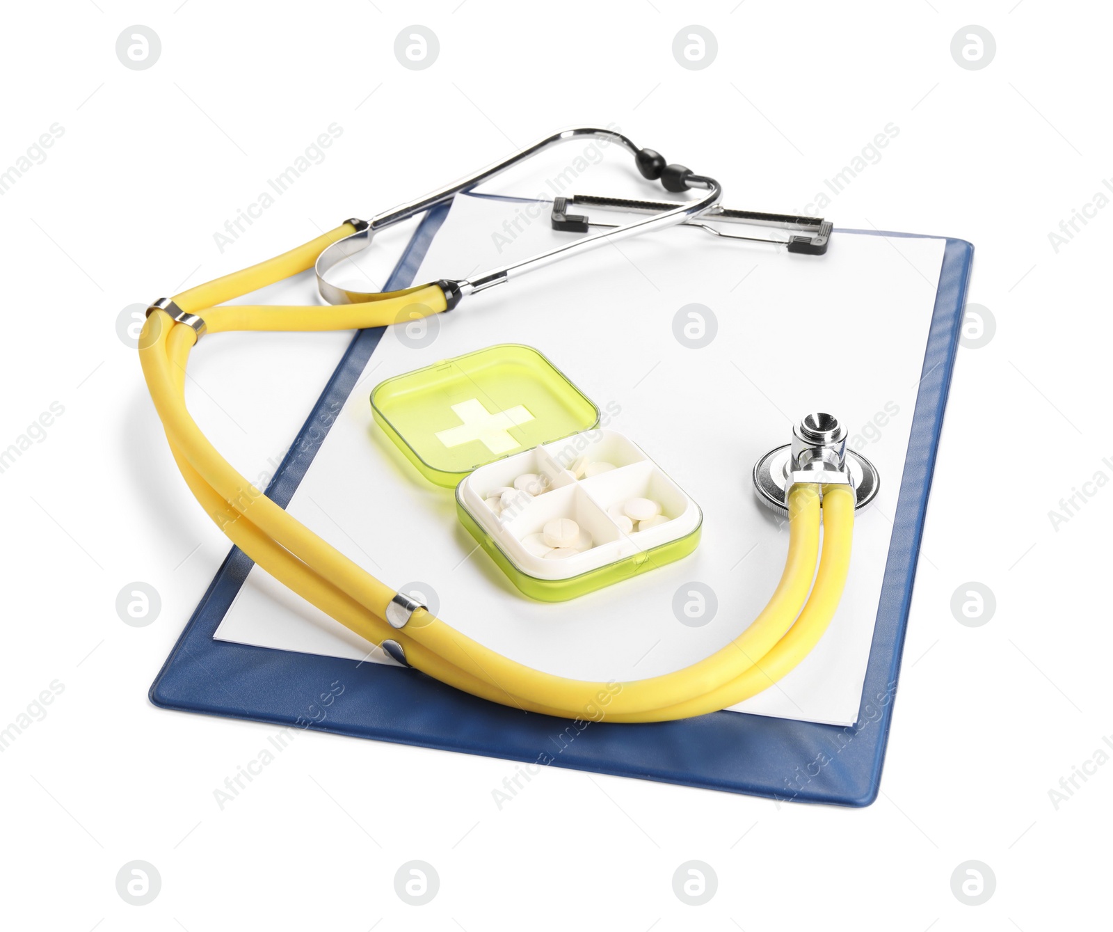 Photo of Clipboard, plastic pill box and stethoscope on white background