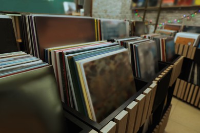 Image of Rack with different vinyl records in store