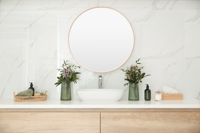 Modern bathroom interior with stylish mirror and vessel sink