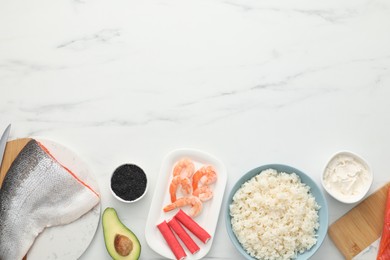 Photo of Making sushi rolls. Flat lay composition with ingredients on white marble table. Space for text