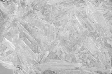 Heap of menthol crystals as background, top view