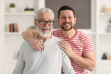 Happy son and his dad at home