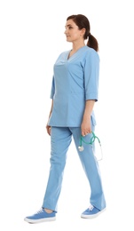 Full length portrait of female doctor in scrubs isolated on white. Medical staff