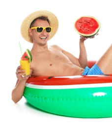 Photo of Shirtless man with inflatable ring, watermelon and glass of cocktail on white background
