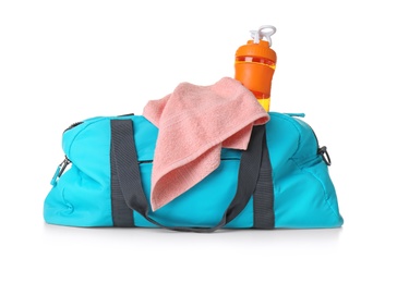 Sports bag with gym equipment on white background