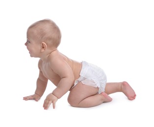 Photo of Cute baby in dry soft diaper crawling on white background