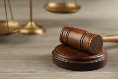 Photo of Wooden gavel on table, closeup. Space for text
