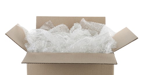 Photo of Transparent bubble wrap in cardboard box isolated on white