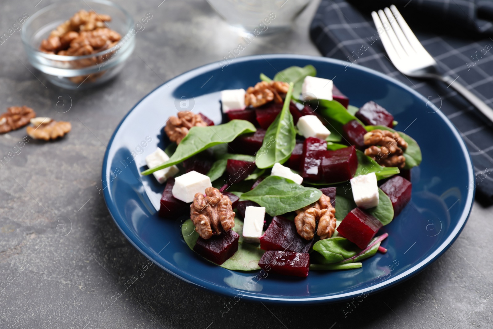 Photo of Fresh delicious beet salad on grey table