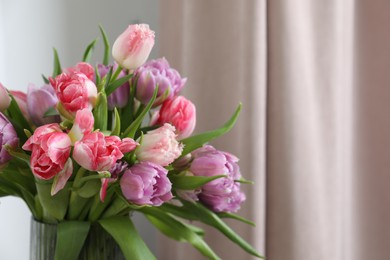 Photo of Beautiful bouquet of colorful tulip flowers indoors. Space for text