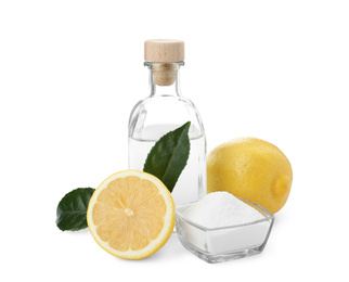 Photo of Baking soda, vinegar and lemon on white background
