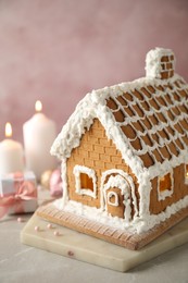 Beautiful gingerbread house decorated with icing on light table