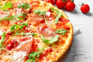 Photo of Tasty hot pizza with meat on table, closeup