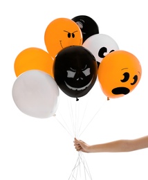 Woman holding color balloons for Halloween party on white background, closeup