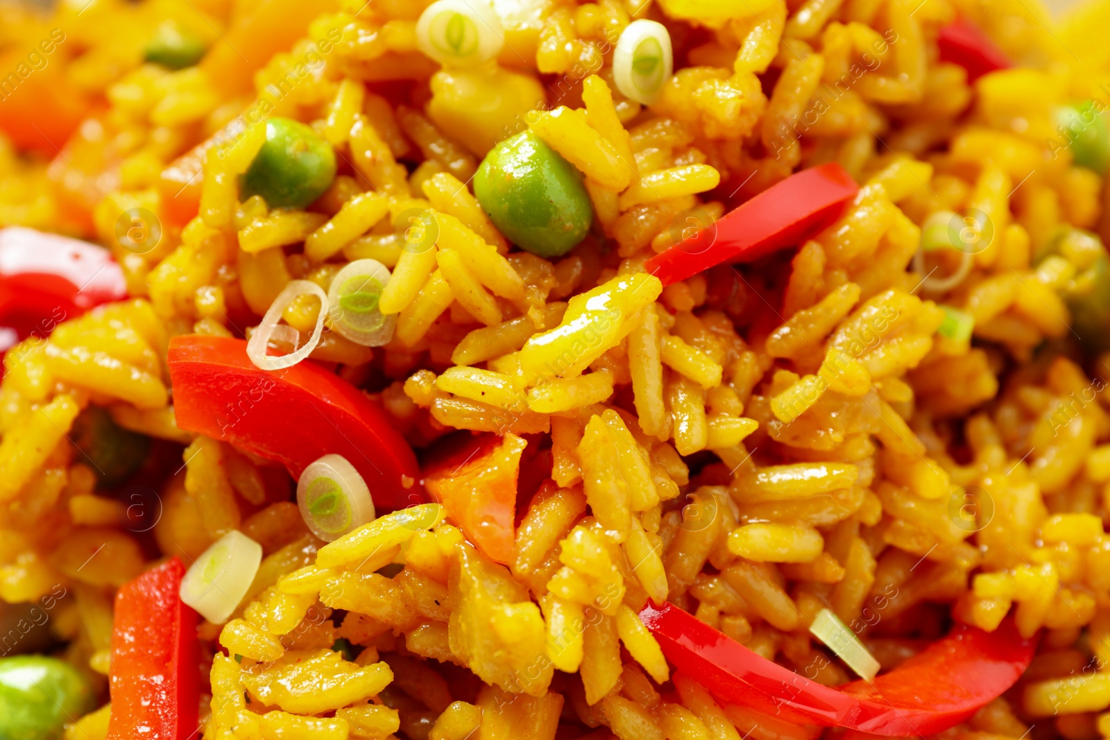 Photo of Delicious rice pilaf with vegetables as background, closeup