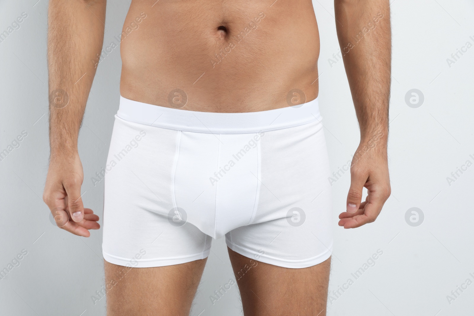 Photo of Man in underwear on white background, closeup