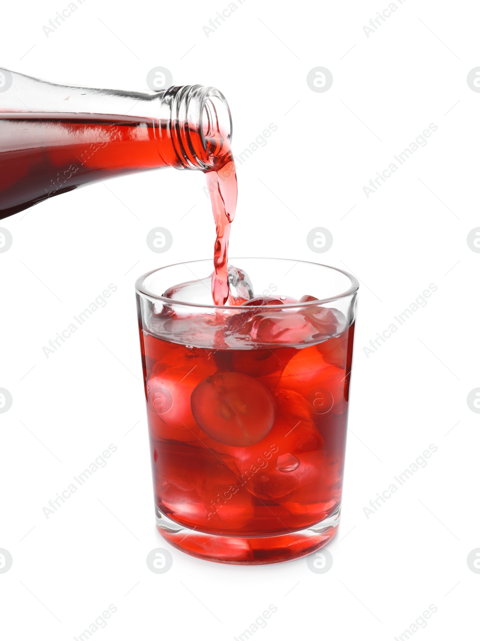 Photo of Pouring grape soda water into glass on white background, closeup. Refreshing drink