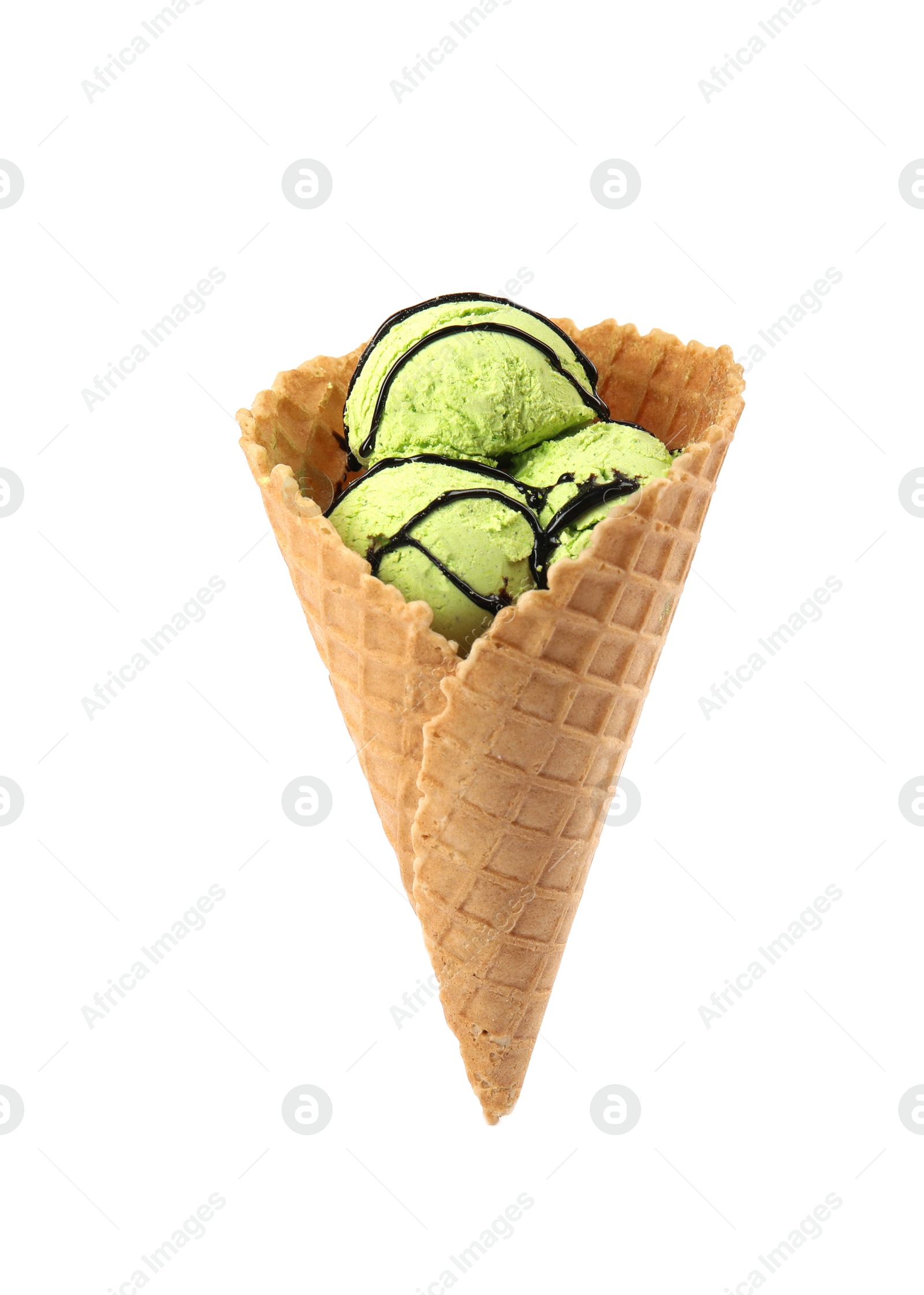 Photo of Delicious ice cream with topping in waffle cone on white background