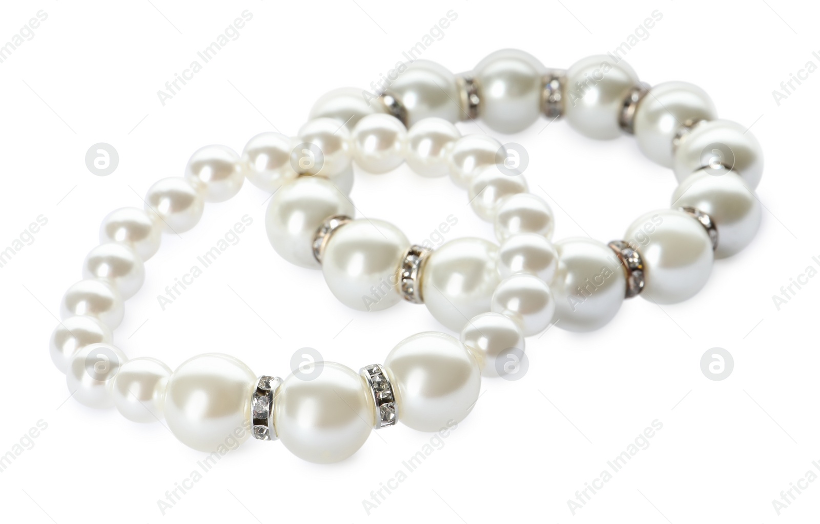 Photo of Elegant pearl bracelets on white background. Luxury jewelry