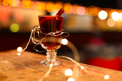 Tasty aromatic mulled wine on table at winter fair