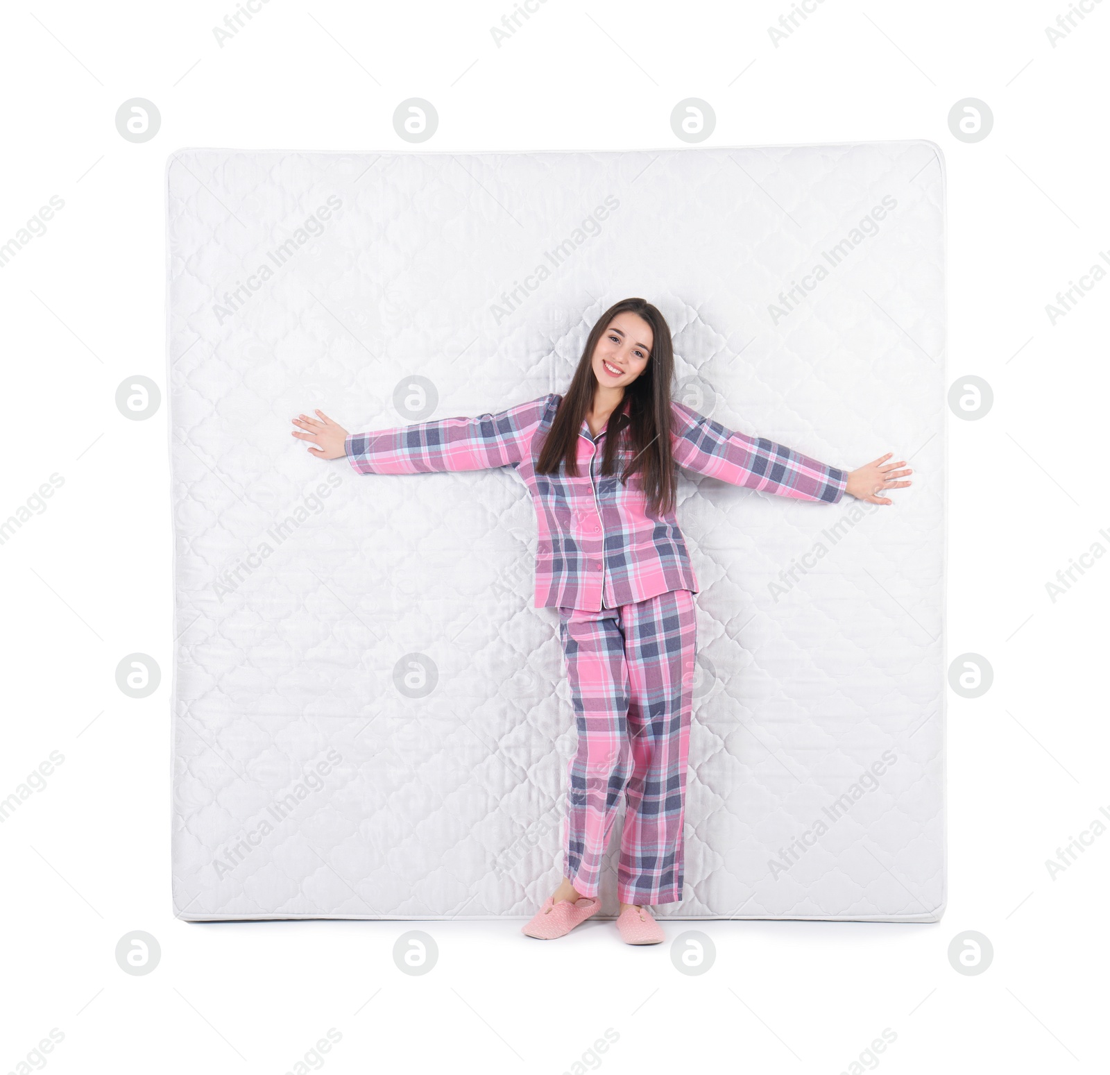 Photo of Young woman with comfortable mattress isolated on white