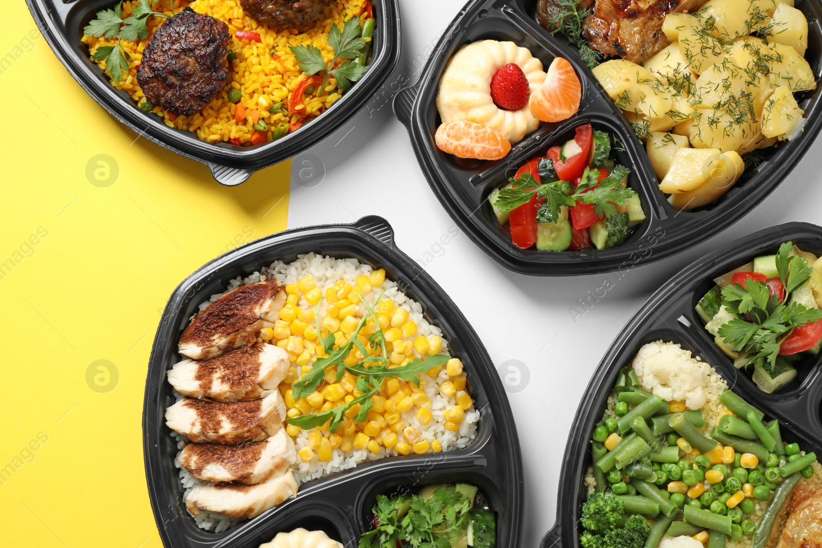 Photo of Lunchboxes with different meals on color table, flat lay. Healthy food delivery