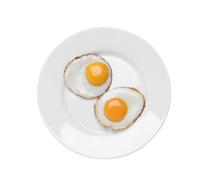 Photo of Plate with delicious fried eggs isolated on white, top view