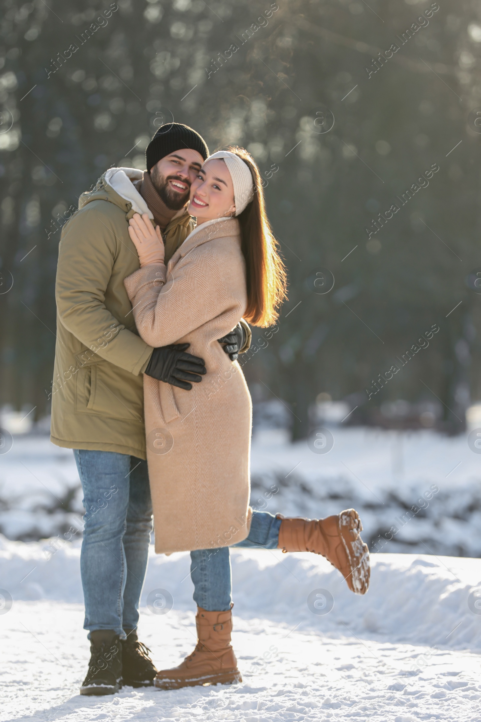 Photo of Beautiful young couple enjoying winter day outdoors