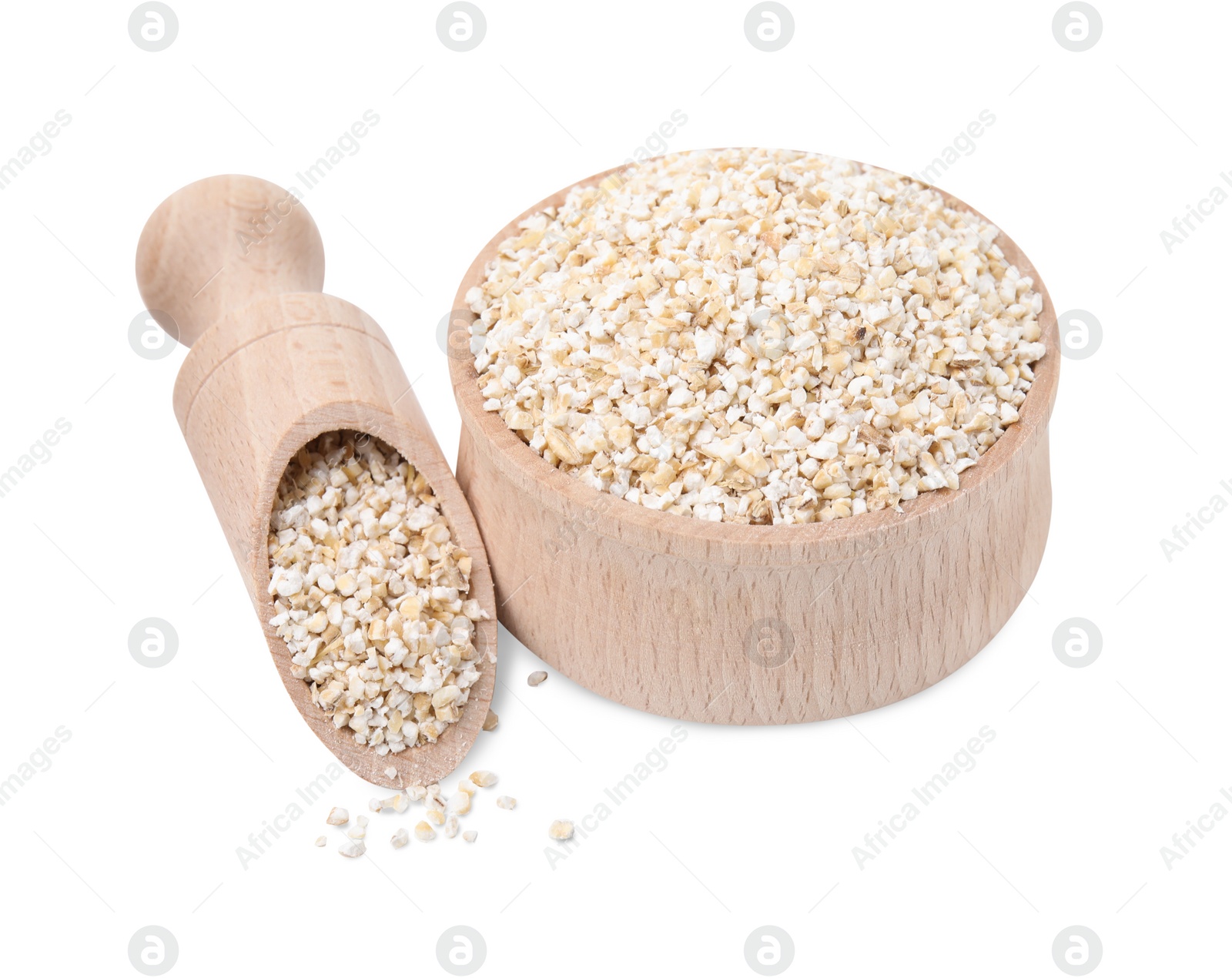 Photo of Raw barley groats in bowl and scoop isolated on white