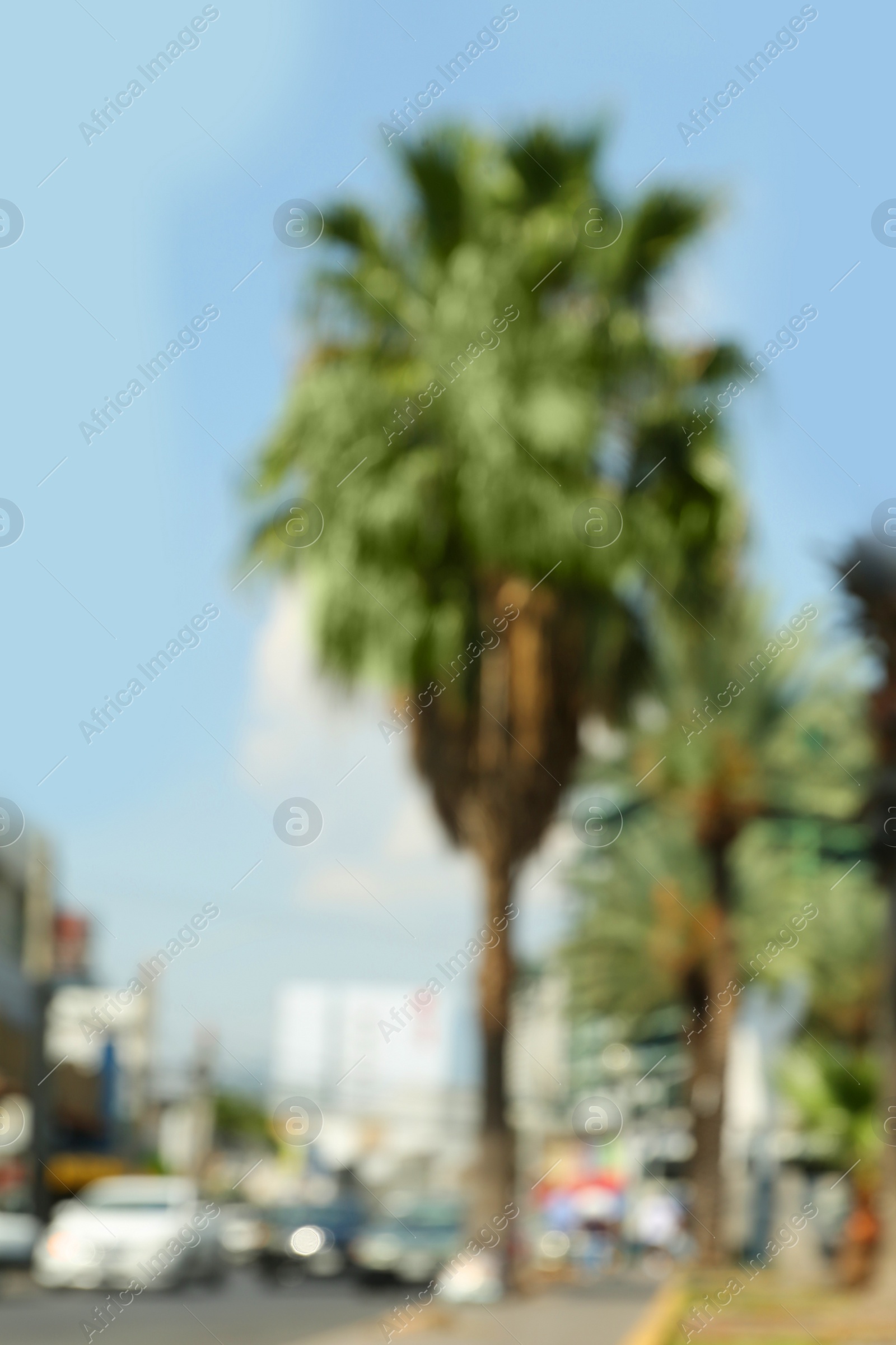 Photo of Blurred view of city street with cars